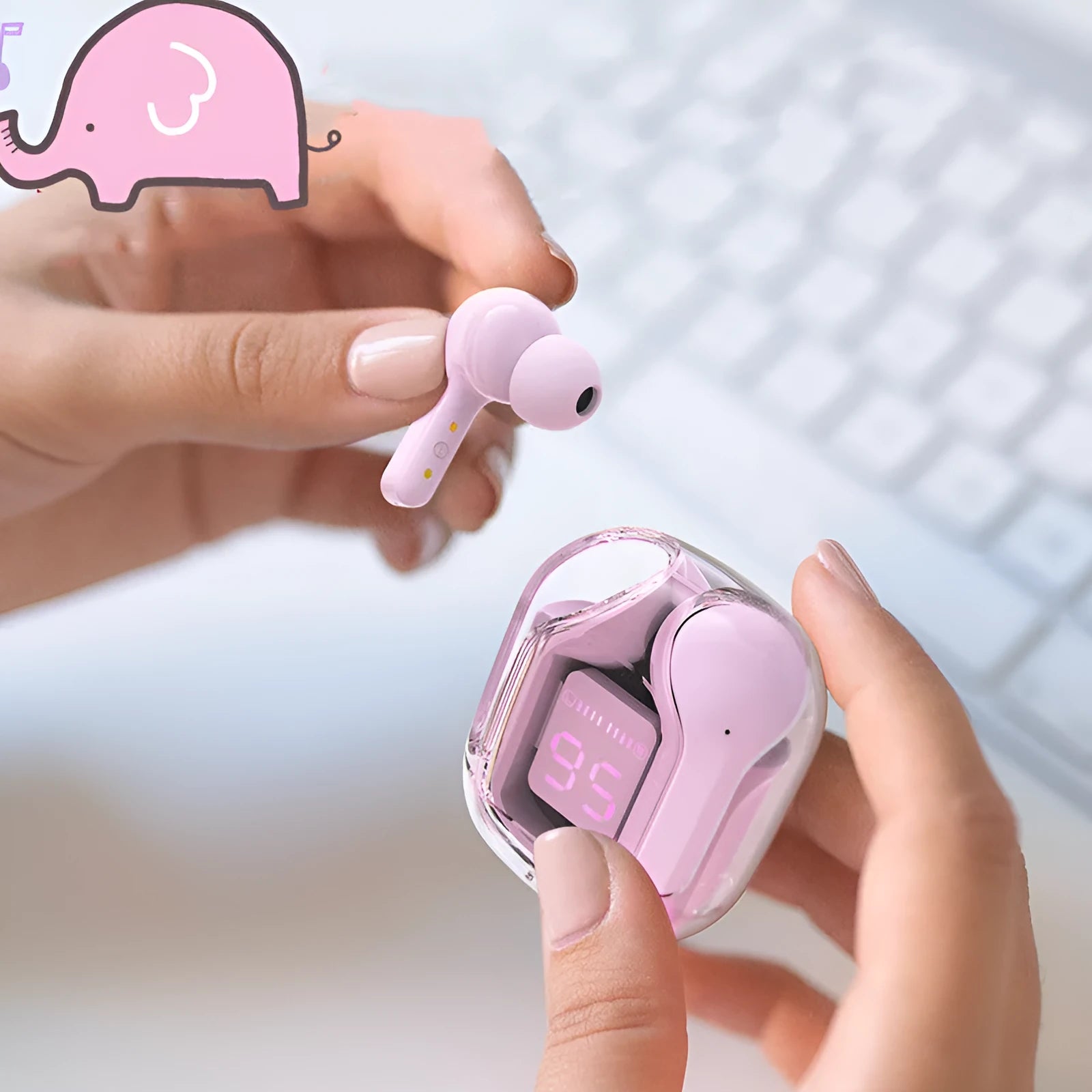 Mini wireless Bluetooth headset in charging compartment with LED battery display, pink colour, silicone case, and USB-C cable