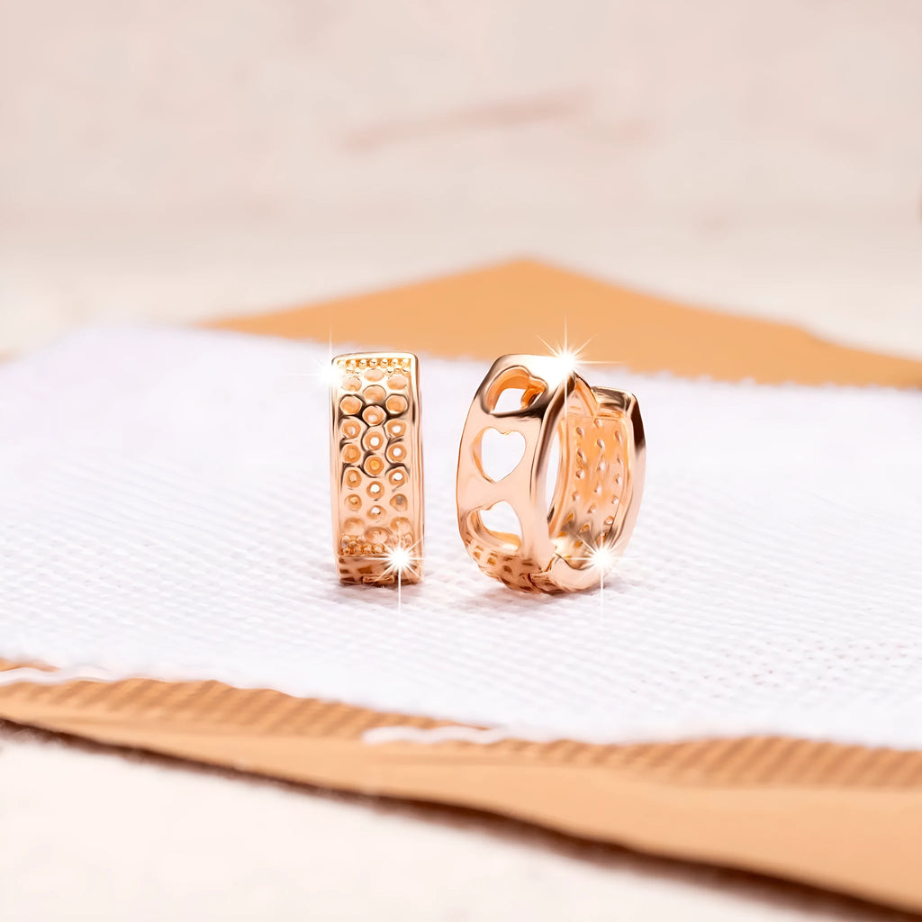 Rose gold hollowed-out heart-shaped earrings with three-layer openwork design