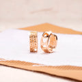 Rose gold hollowed-out heart-shaped earrings with three-layer openwork design