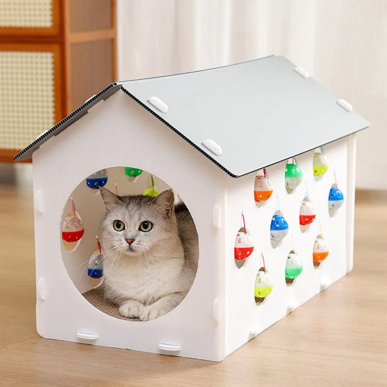Plastic cat scratch board house with integrated tunnel containing bell ball and nest bed area