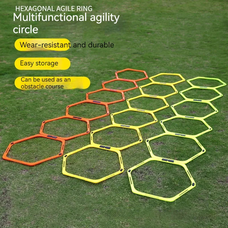 Set of six foldable yellow, green, and orange hexagon football agility training rings on grass