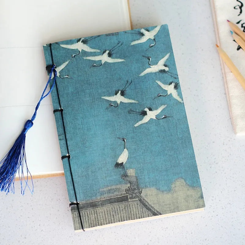 A5 antique thread-bound notebook with embossed cover and decorative tassels