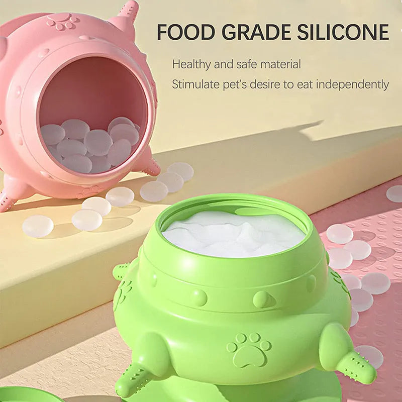 Pink silicone pet nursing bottle with bionic breast design and four pacifiers on a flat base.