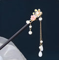 Chinese ancient style floral alloy hairpin with electroplated finish on dark background