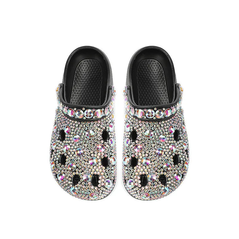 Black women's platform sandals with rhinestone decoration and a holey EVA upper.