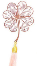 Brass metal bookmark with hollow leaf design and rose gold tassel in a presentation box.