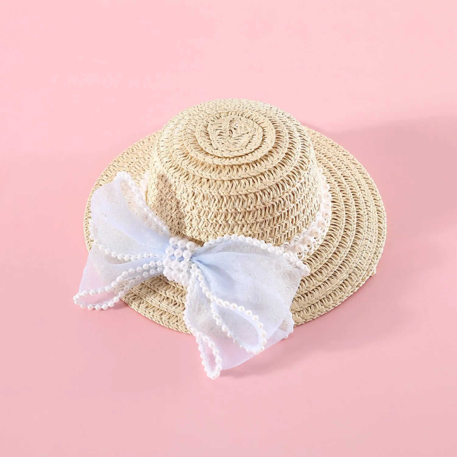 Woven Lafite leaf cat hat with pearl butterfly bow on a pink background, showing S and M size options.