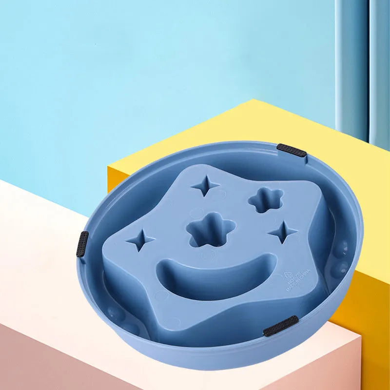 Large blue slow feeder dog bowl with raised moon and star wing patterns and a non-slip rubber base.