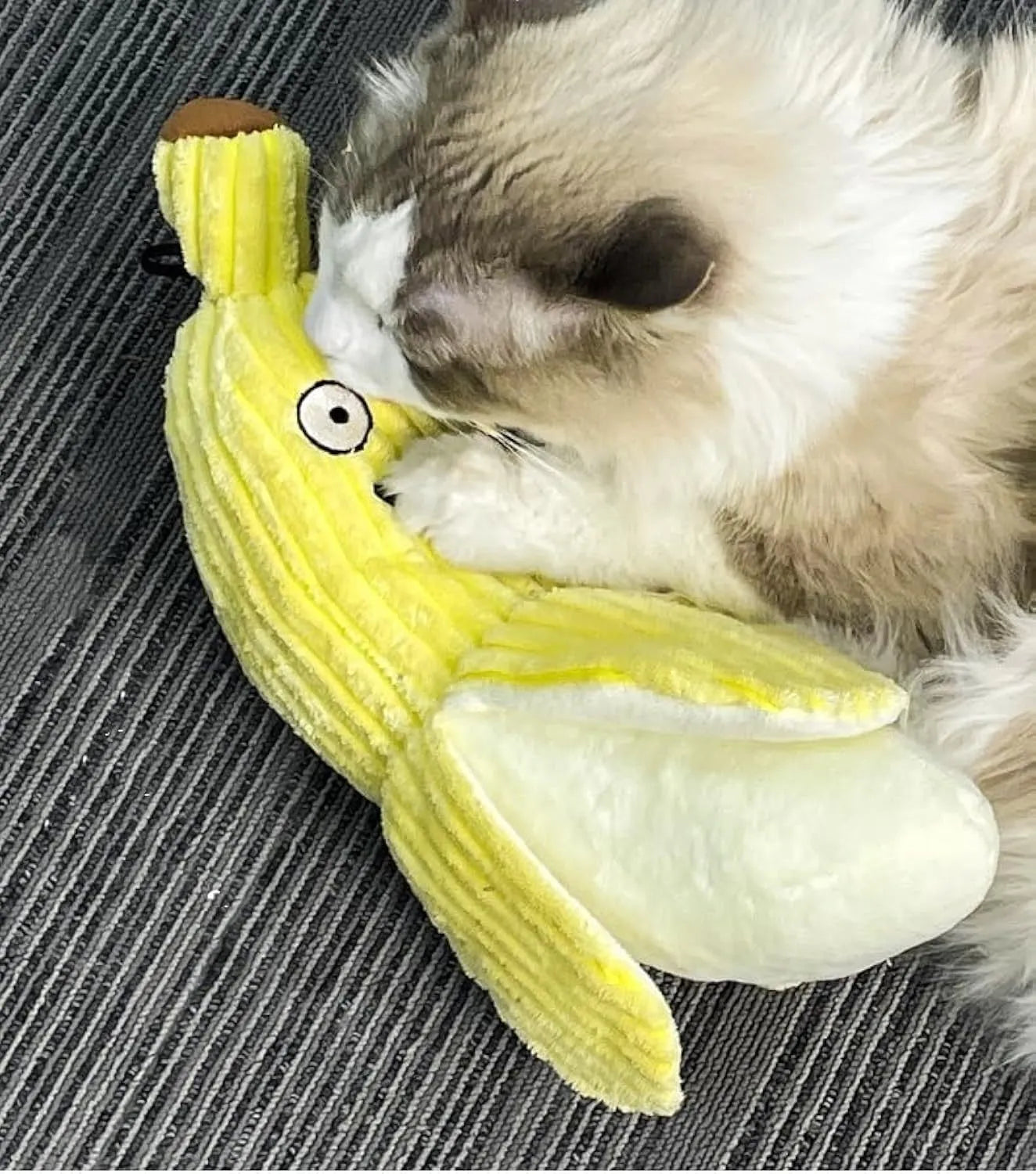 Yellow banana-shaped cat crinkle toy with catnip filling measuring 13 inches long