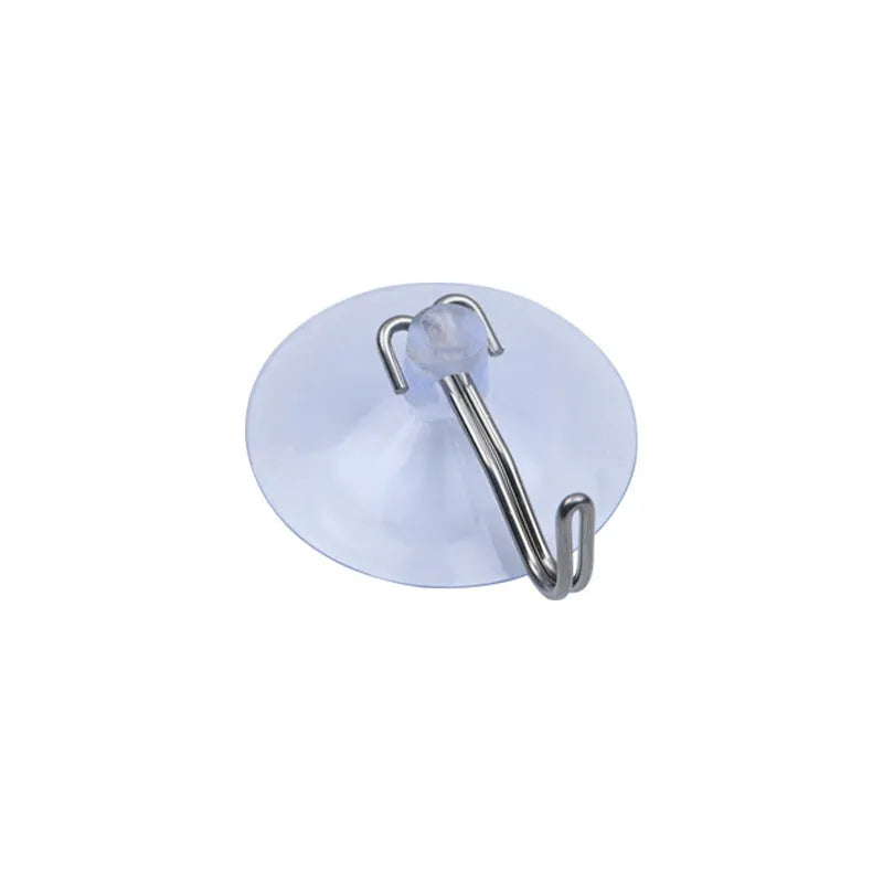 PVC suction disc hooks in assorted sizes and styles including iron hooks and key ring sucker on a glass surface