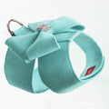 A soft microfiber dog chest strap with a decorative bowknot, shown in pink, blue, and orange colour options.