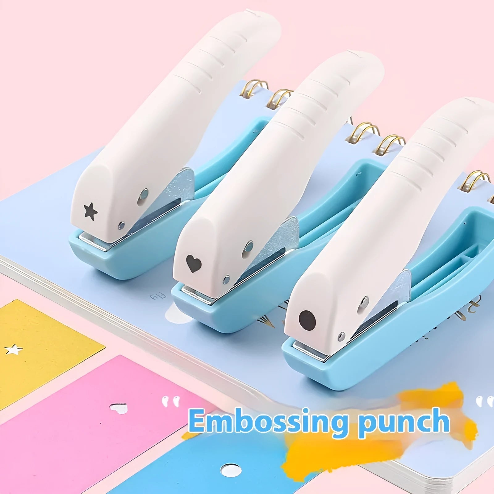 Small manual embossing punch tool showing Love, Star, and round hole shapes for paper crafts