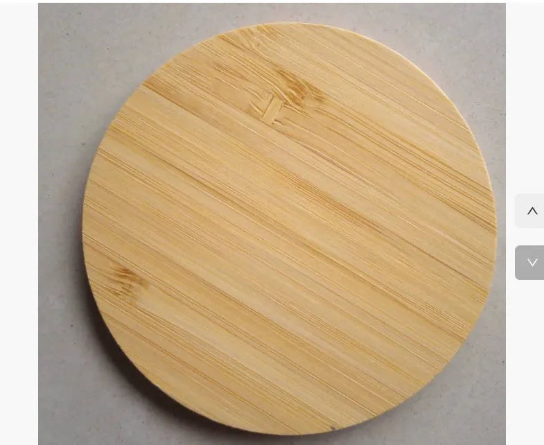 Square wooden bamboo 5W QI wireless charging pad for smartphones on a desk.