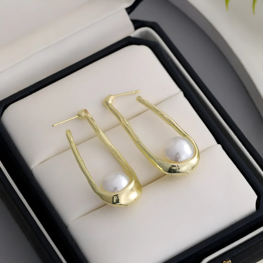 Vintage irregular pearl clip-on earrings in gold colour for women, fashion accessory