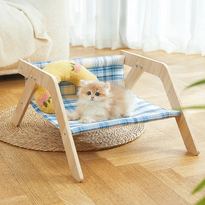 Wooden elevated cat bed hammock with cloth cushion in blue or green colour.