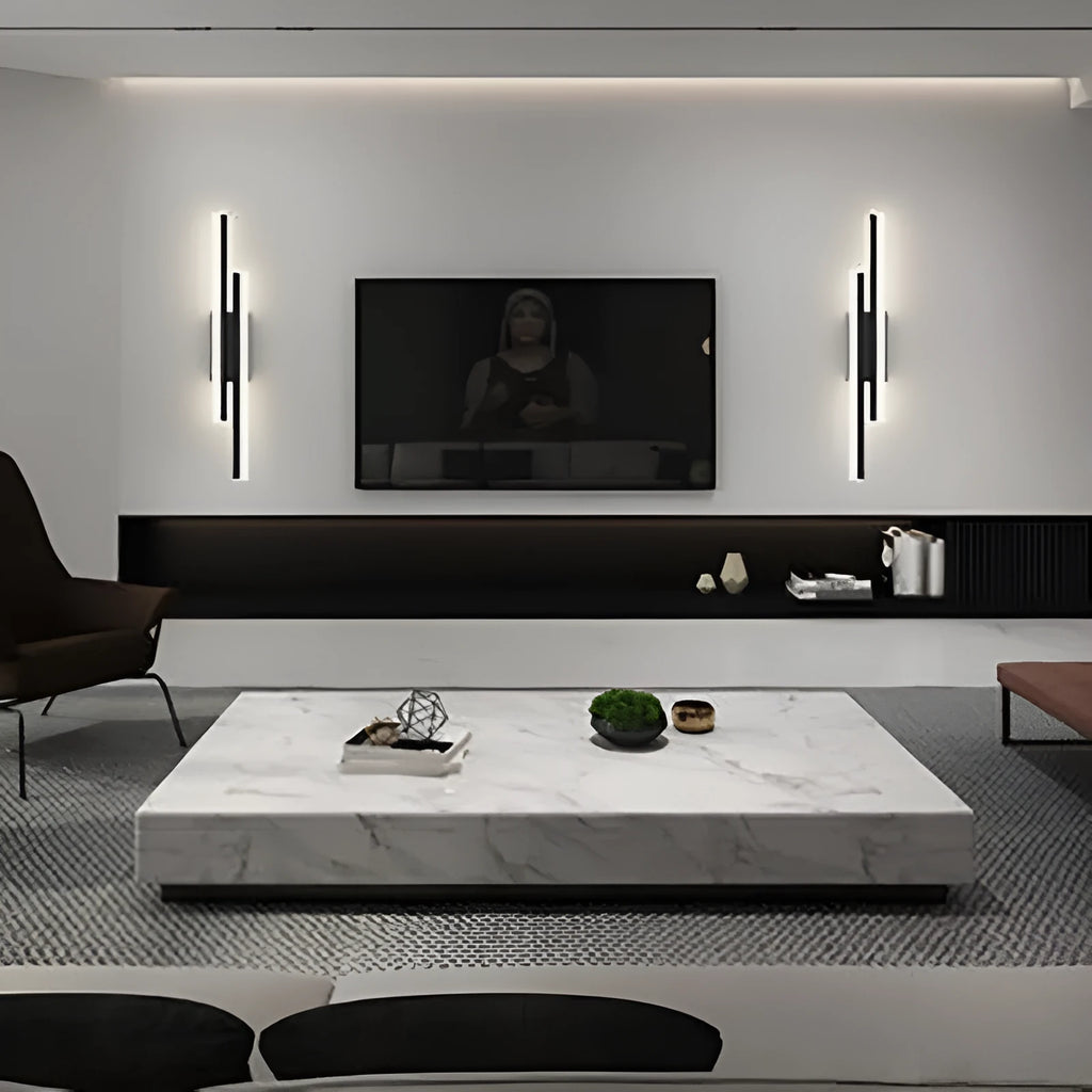 Minimalist Scandinavian LED wall light with black metal arm and white acrylic shade mounted on a wall.