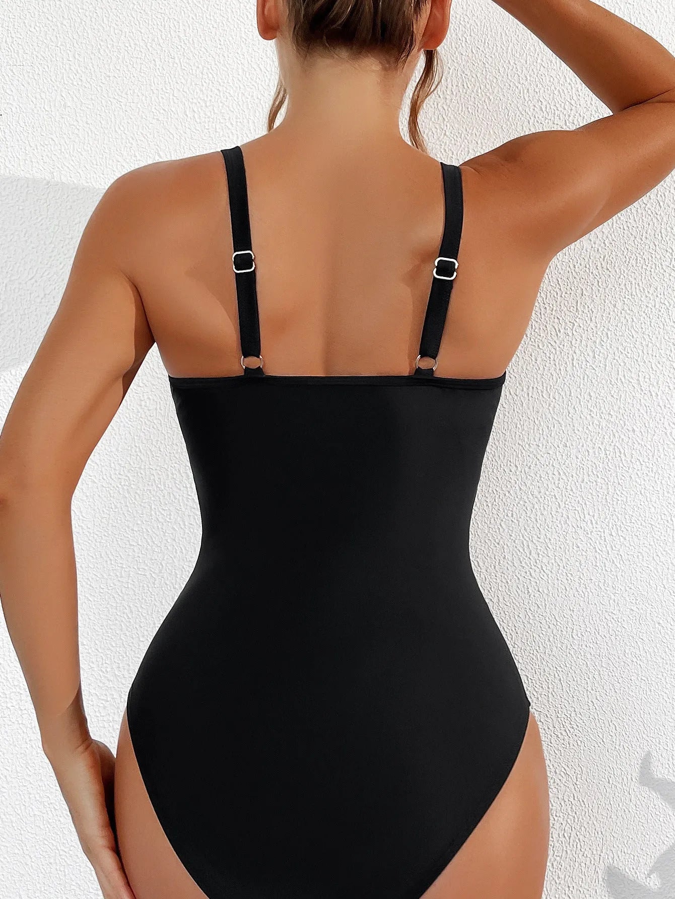 Black women's one-piece swimsuit with mesh halter detailing and sleeveless briefs style