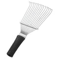 Stainless steel dematting brush rake comb for grooming horses and dogs on a wooden surface