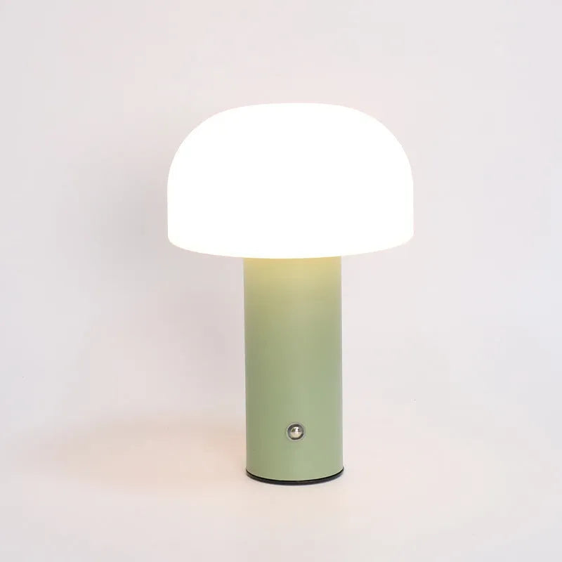 USB-powered plastic table lamp in a choice of black, green, orange, or white colour styles on a desk.