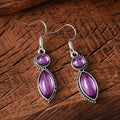 Geometric vintage earrings with black and purple gemstone accents in bohemian style