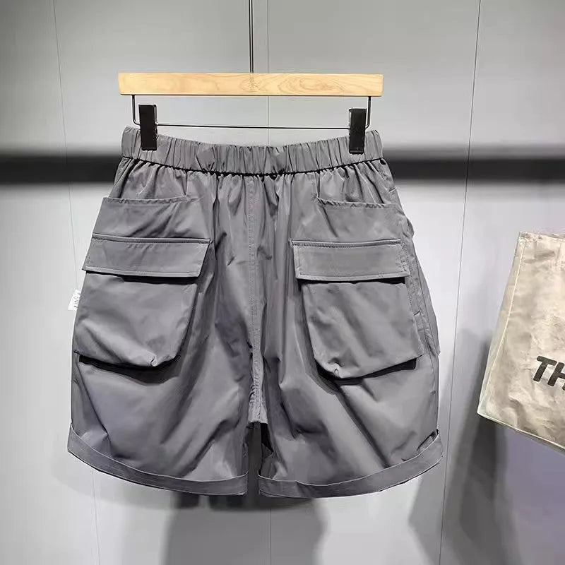 Men's large size work shorts in black or grey with loose pockets and straight leg hem