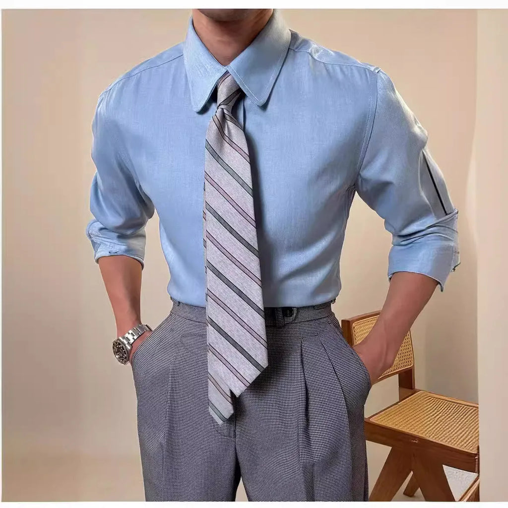 Man wearing a slim-fit light blue round collar long sleeve shirt for business casual wear.