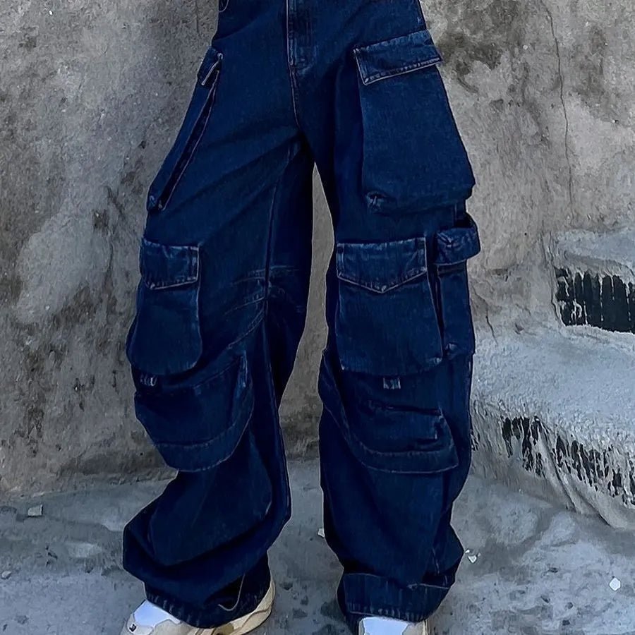 Dark blue distressed women's wide-leg jeans with a high waist and multiple pockets on a mannequin.