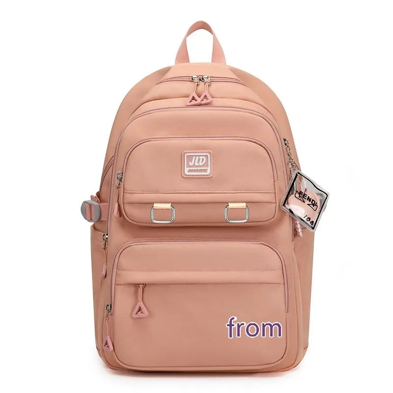 Purple girls' large capacity nylon backpack with a physiological curve backplate for school use.