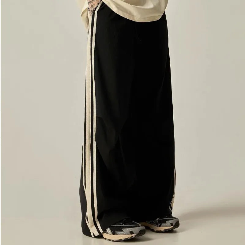 Black men's wide leg climbing trousers with high waist and straight leg design.