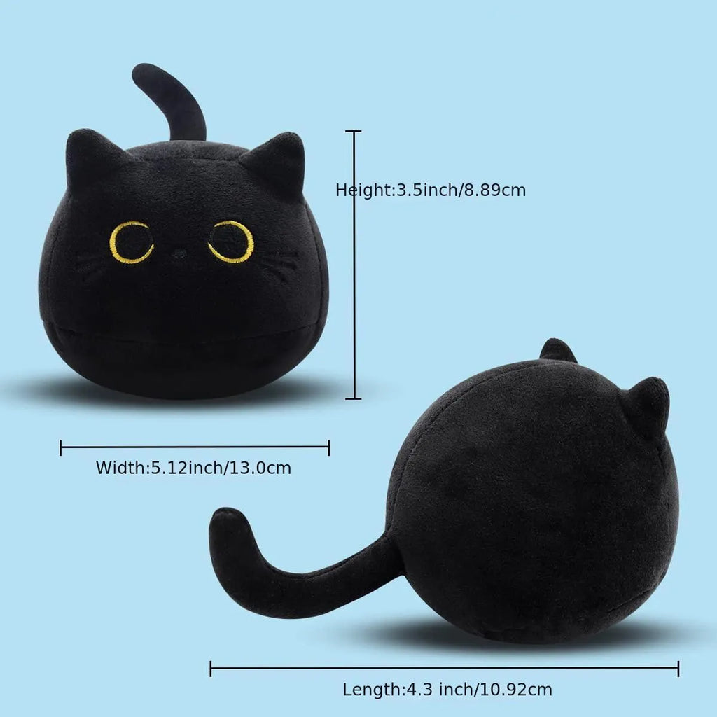 Fluffy black cat plush toy stuffed animal cushion on a sofa