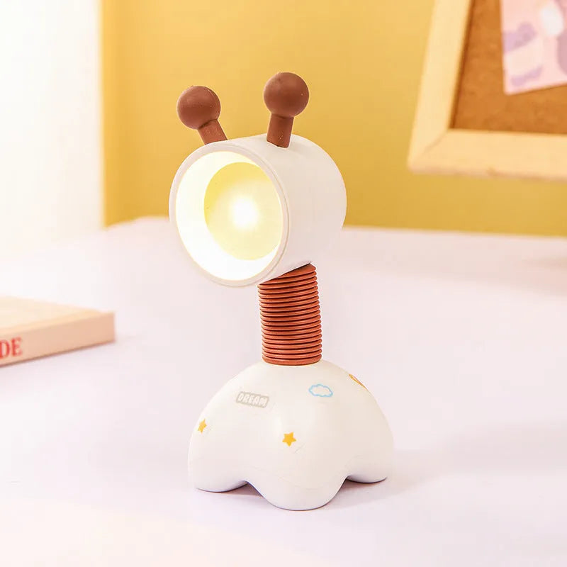 DIY cartoon magnetic small night lamp in assorted animal styles and colours on a desktop.