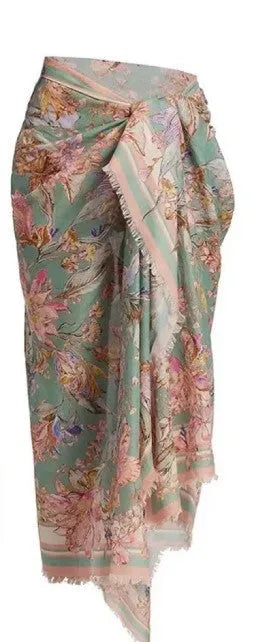Creamy white floral print women's bikini set with matching skirt on a mannequin.
