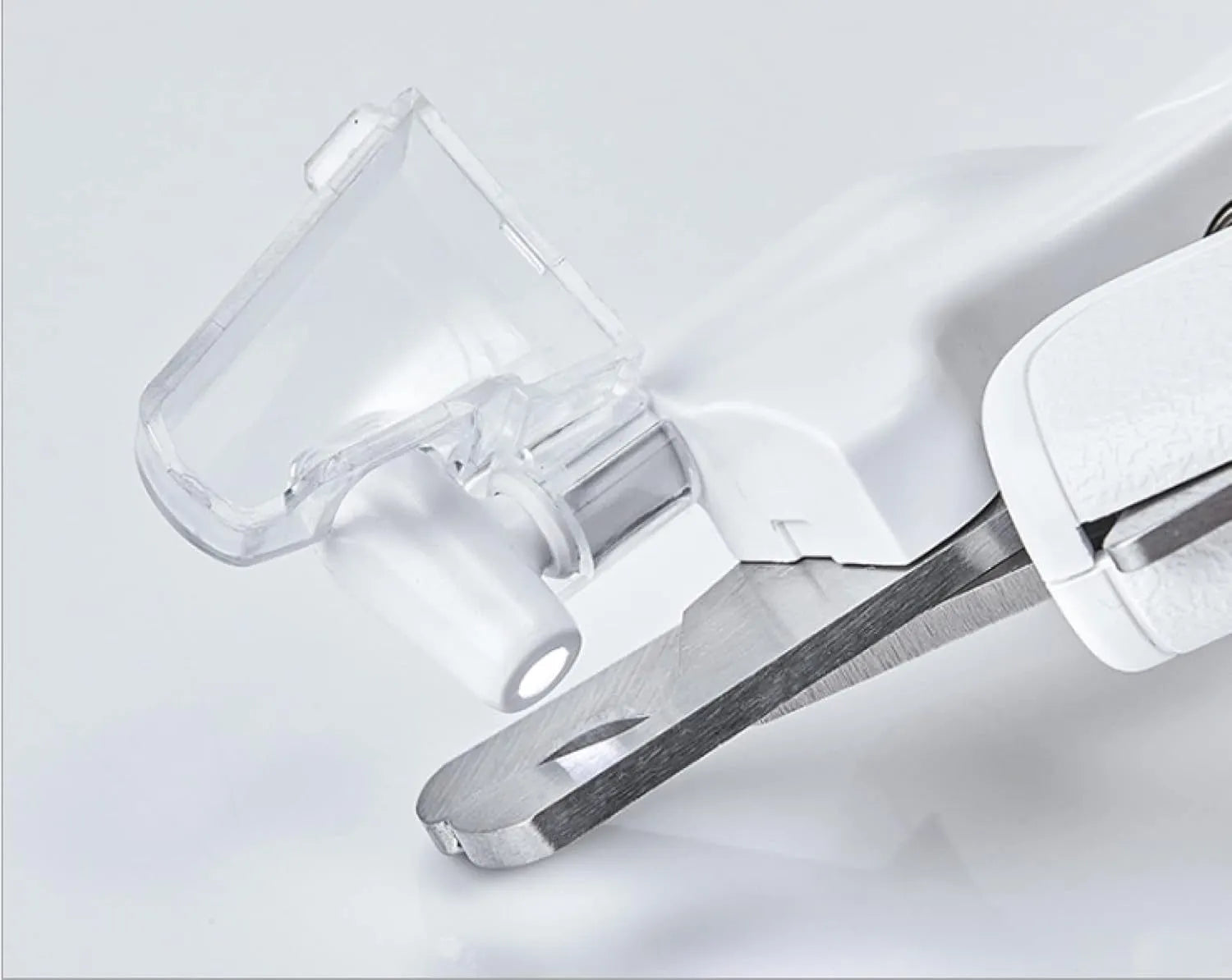 White pet nail clippers with LED light, anti-splash transparent guard, and a leather-like handle on a blue background.