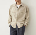 Men's simple profile long sleeve shirt in light sand rice colour with collage stitching detail.