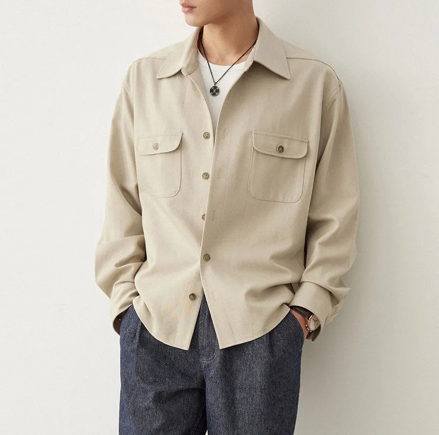 Men's simple profile long sleeve shirt in light sand rice colour with collage stitching detail.