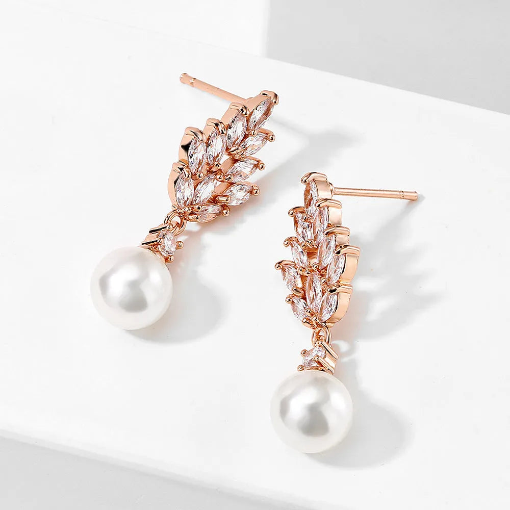 Geometric floral design earrings with micro inlaid zircon detail in gold, platinum, or rose gold plating.