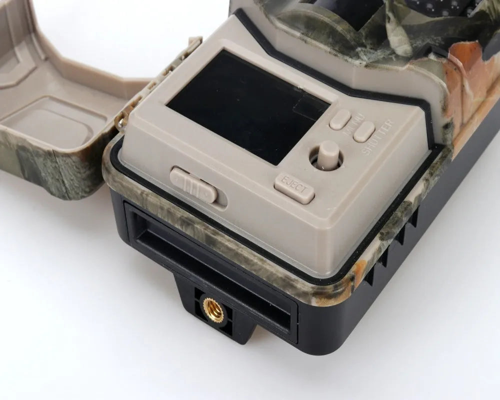 Camouflage outdoor Bluetooth trail camera with infrared LEDs for night vision, showing compact design.