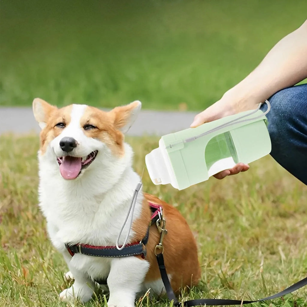 Green 2-in-1 travel dog water bottle with lanyard, showing water dispenser and food container compartments.