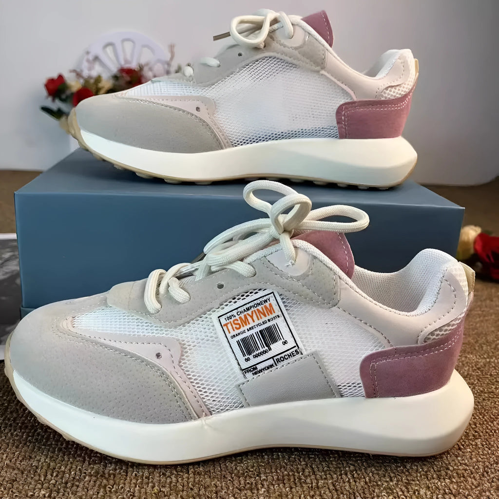 Women's grey and pink retro sneaker with low-top design and rubber sole