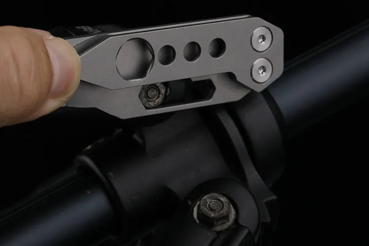 Titanium alloy multi-function crowbar tool with integrated bottle opener in gun grey or stone wash finish.
