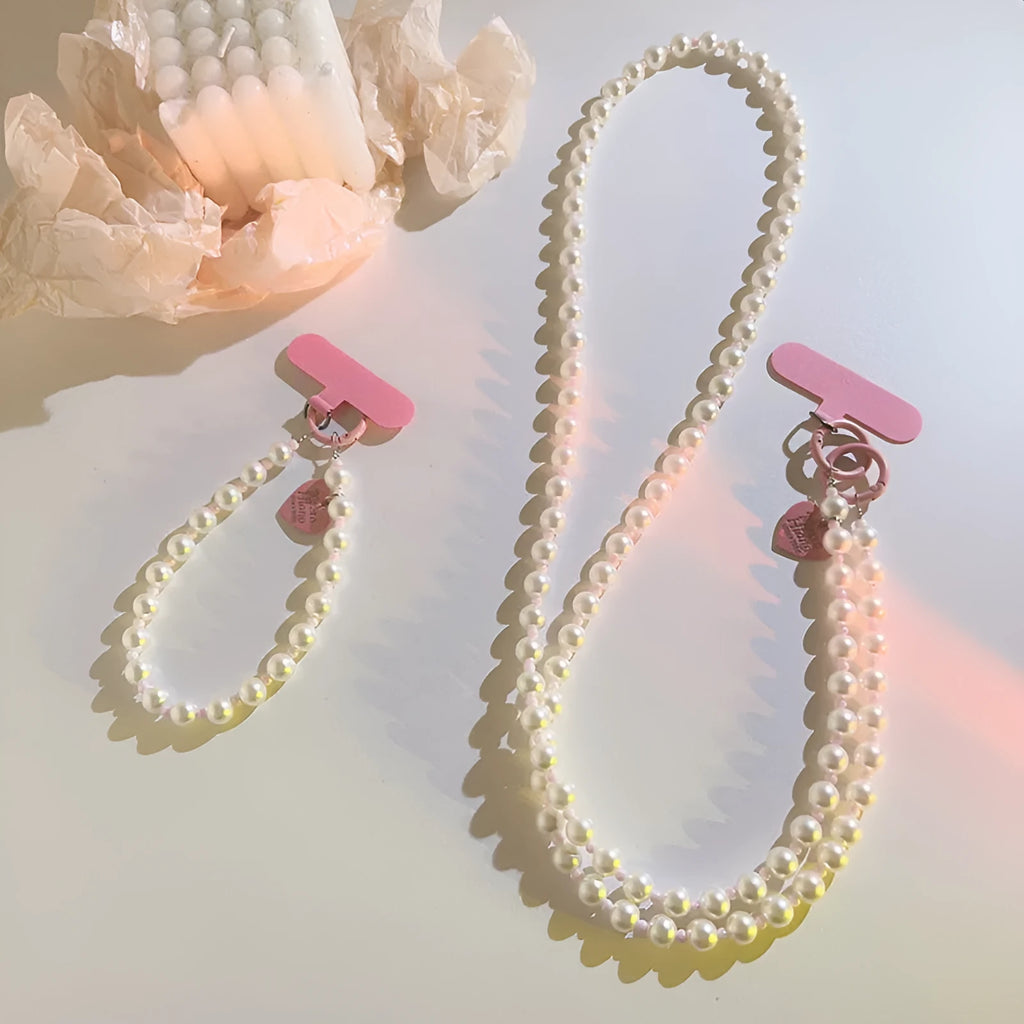 Pink pearl bead mobile phone lanyard with crossbody shoelace and wrist strap on white background