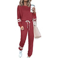 Women's plus size loose-fitting casual suit in a solid colour with long sleeves and matching trousers.