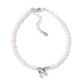 Women's natural freshwater pearl bracelet in 925 silver with letter shape charm on neutral background