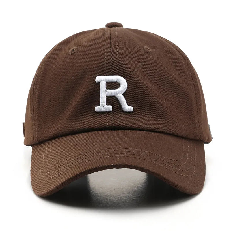 Adjustable unisex baseball cap with embroidered letter R in black cotton satin weave with brim