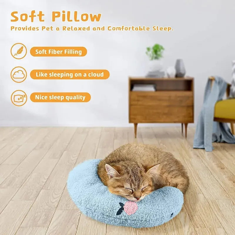 Small blue U-shaped pet pillow with faux fur, showing raised rim and half-donut shape for cats or small dogs.