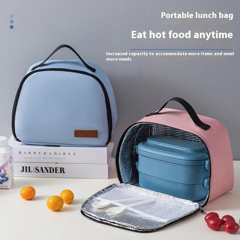 Insulated textured cloth lunch box bag in sapphire blue colour, shown with a lunch box inside.