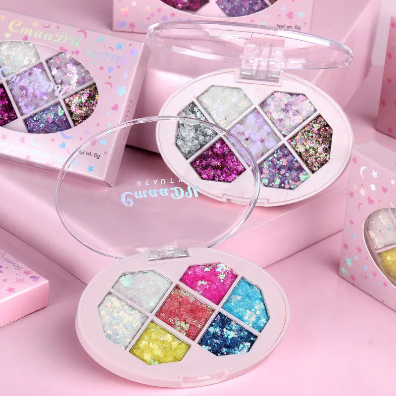 Small pot of glitter eye shadow gel cream with shimmer sequins in seven colour options for face and body festival use