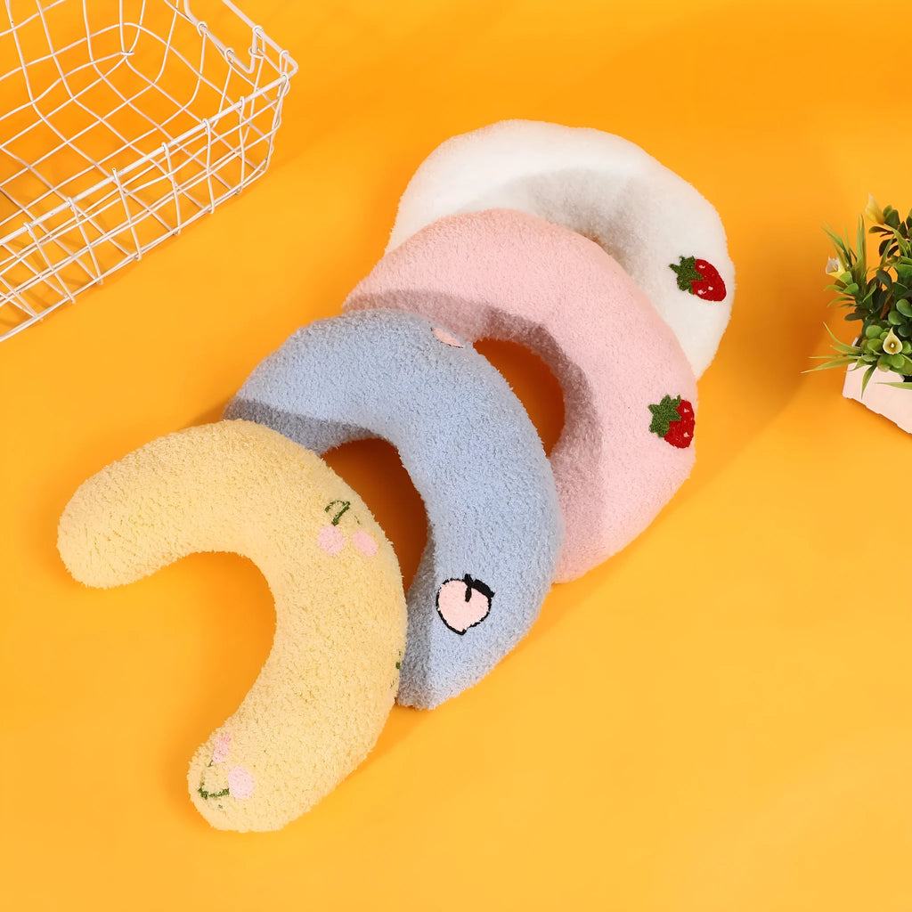Half moon U-shaped cloth pillow for cats in blue, pink, white, and yellow colour options.