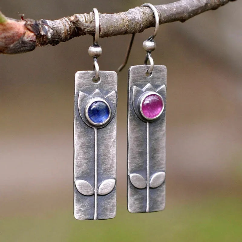 Red sapphire earrings with antique electroplated finish and geometric ellipse design