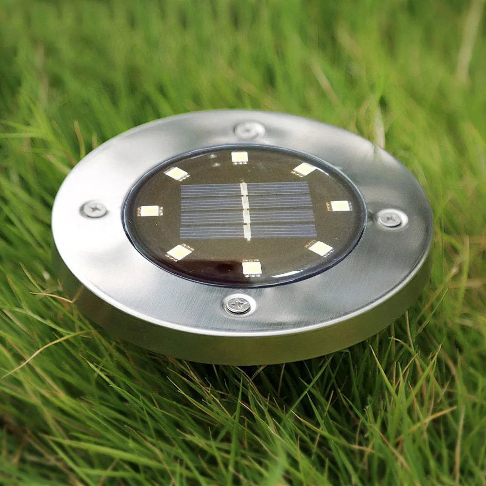 Four solar powered stainless steel lawn lights with LED, 12x12x13cm, warm white or white light option